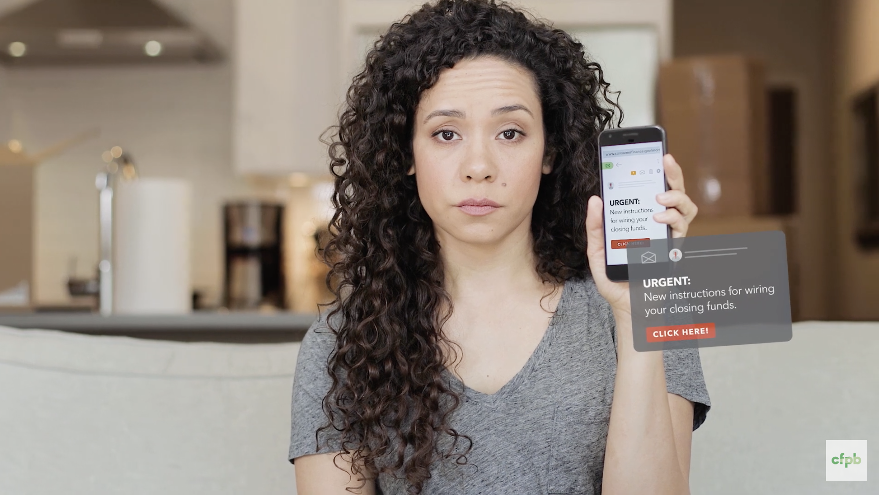 Woman holding up a phone with a graphic attached to the phone that says "urgent"